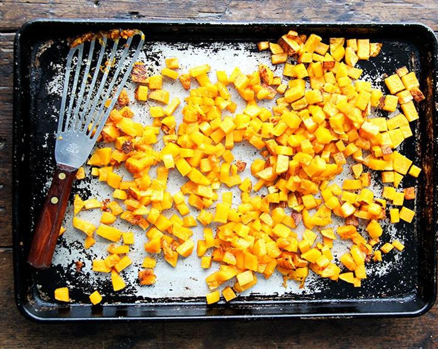 step 2 Spread Butternut Squash (9 3/4 cups) on each sheet pan and toss with Vegetable Oil (1 Tbsp) until coated well. Add additional tablespoon of oil if necessary.
