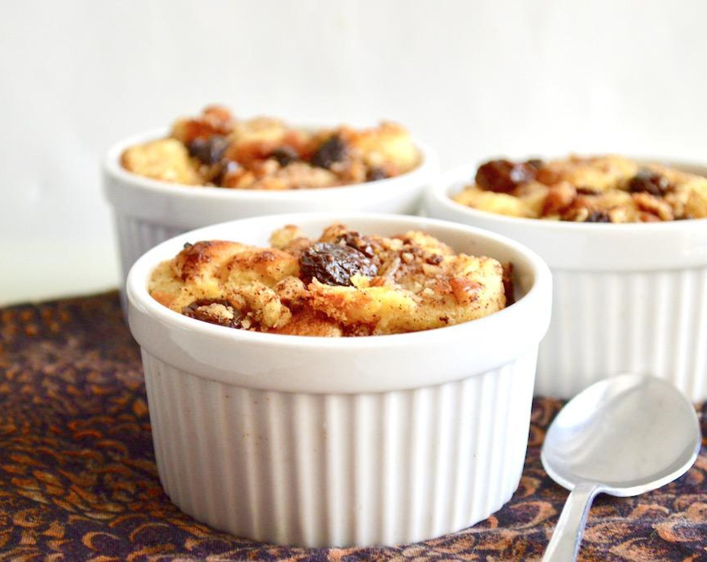 step 8 Bake everything until the custard sets and the top starts to brown, about 45 to 50 minutes. Serve warm immediately and enjoy!