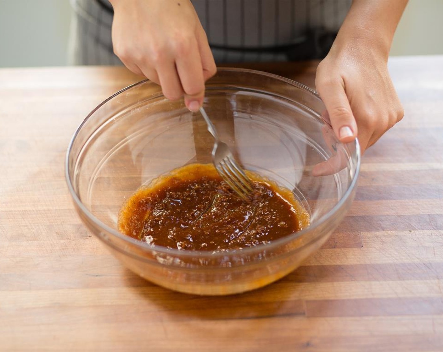 step 6 In a large bowl, whisk together Teriyaki Sauce (1/4 cup), Peanut Butter (1/4 cup), Rice Vinegar (1/2 Tbsp), and Sriracha (1/2 Tbsp) until smooth.