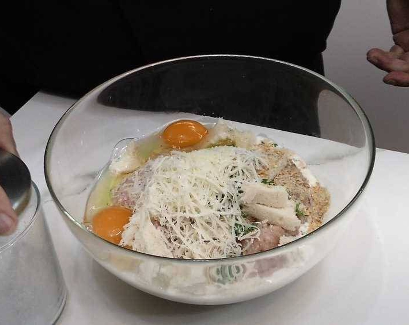 step 1 In a large bowl add the Ground Chicken (1.8 lb), Bread (1 slice), Eggland's Best Classic Eggs (2), Simply Organic Onion Powder (2 tsp), Ground White Pepper (1 tsp), Simply Organic Garlic Powder (1 tsp), Salt (to taste), Milk (1 splash), Fresh Parsley (to taste), and Aged Goat Cheese (to taste). Mix together until well combined.