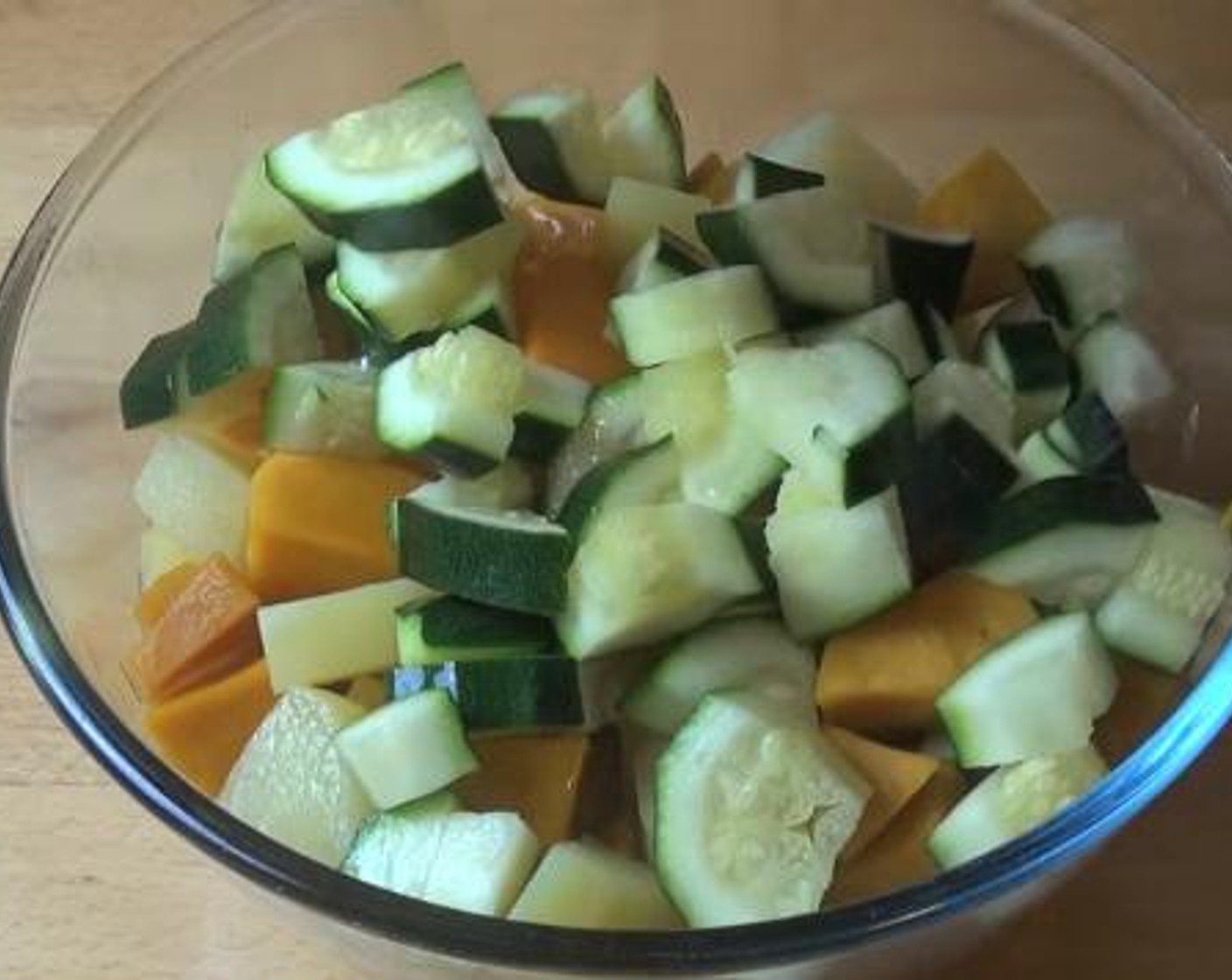 step 1 Into a bowl, add in your cooked  Pumpkins (3 1/2 cups), cooked Potatoes (14 oz), and Zucchini (1). Toss everything to combine.