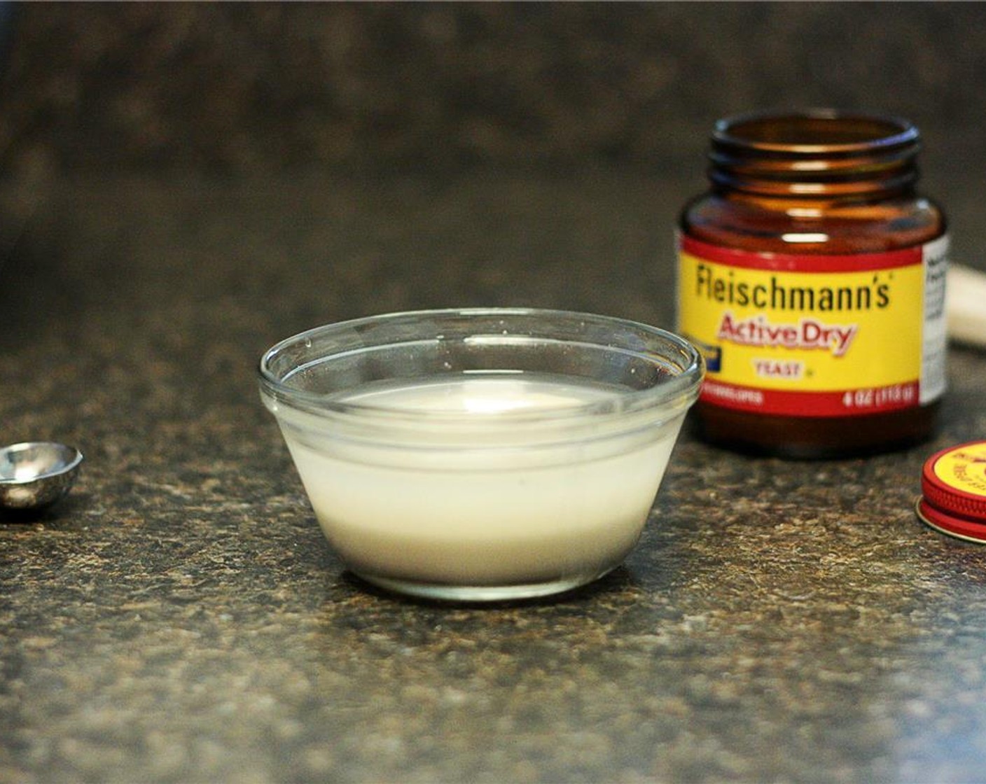 step 1 Dissolve Active Dry Yeast (1 tsp) in one third, or 1/2 cup of warm Water (1/2 cup). Allow it to sit for a few minutes until it’s somewhat frothy in appearance.