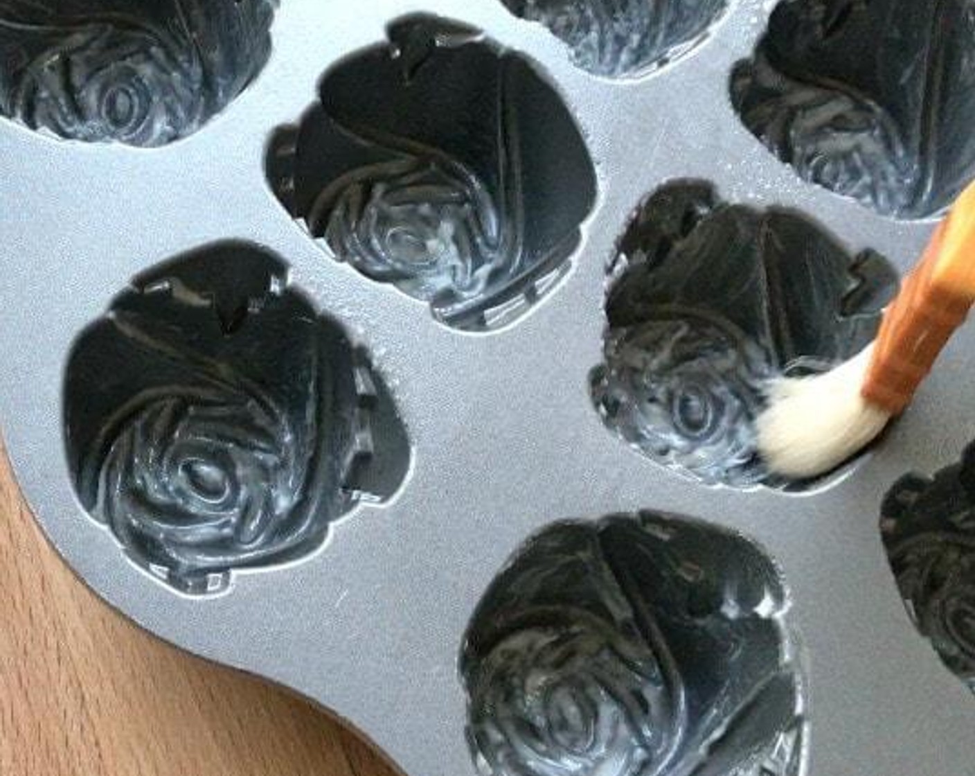 step 2 Grease extensively a 12-well sweetheart rose cake pan with pan grease or non-stick cooking spray.