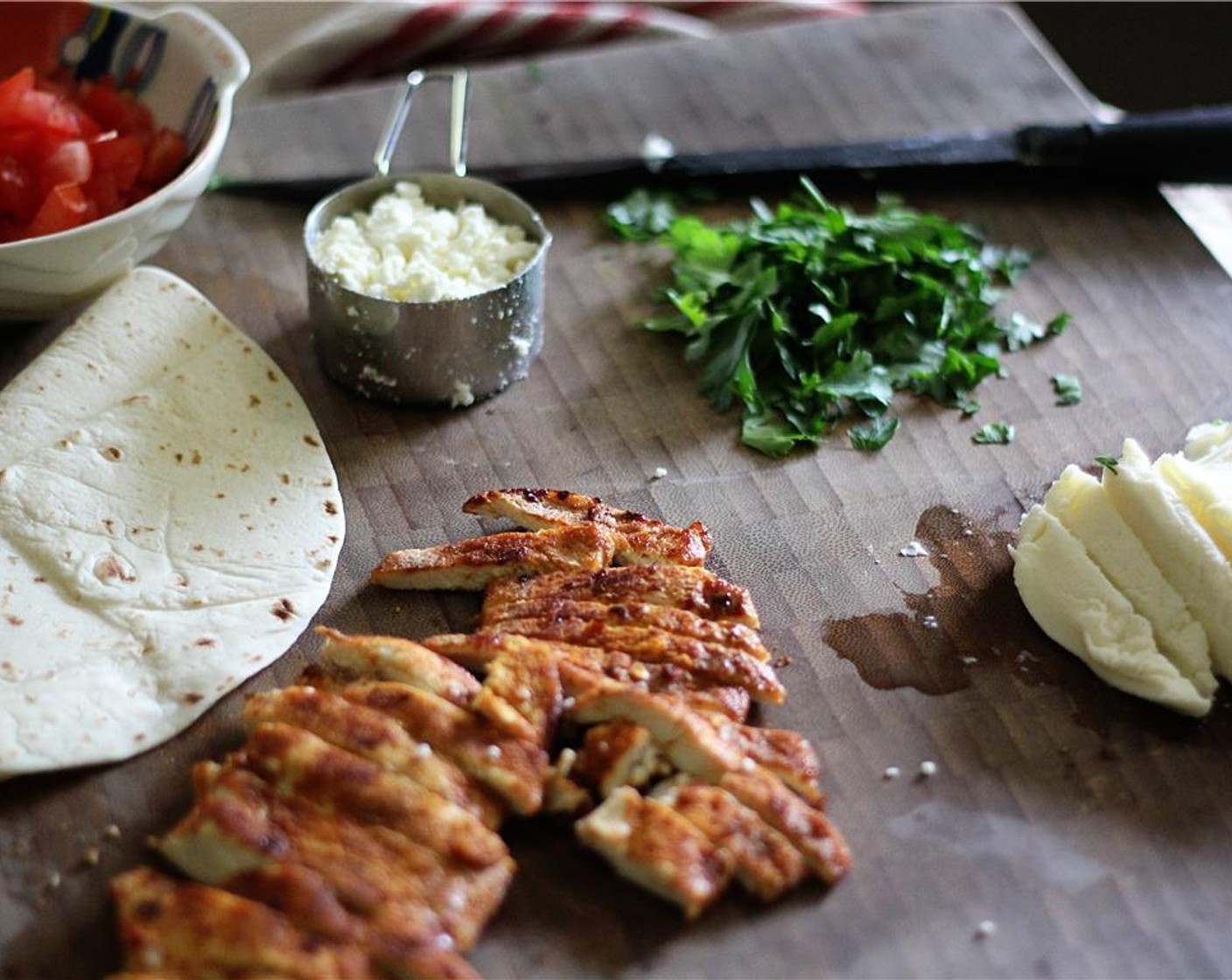 step 2 Heat Olive Oil (2 Tbsp) in a large skillet over medium-high heat. Add in seasoned chicken and cook until brown on both sides, turning once, about 6-9 minutes. Sliced cooked chicken into strips and set aside.