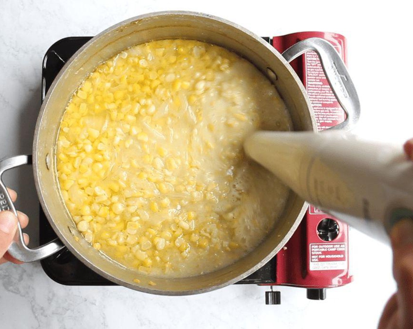 step 6 If you have an immersion blender, use it to carefully blend the soup until it is puréed. If you don't have one, work carefully and quickly to purée it in batches in a blender or food processor. For a very silky texture, strain the soup one last time through a fine-mesh sieve.