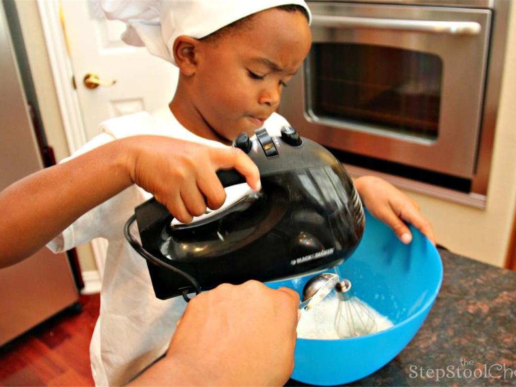 Step 10 of Simple Vanilla Soufflé Recipe: Then you beat the egg whites on medium high speed and add Granulated Sugar (2 tablespoon). Continue mixing until it gets thick and foamy.