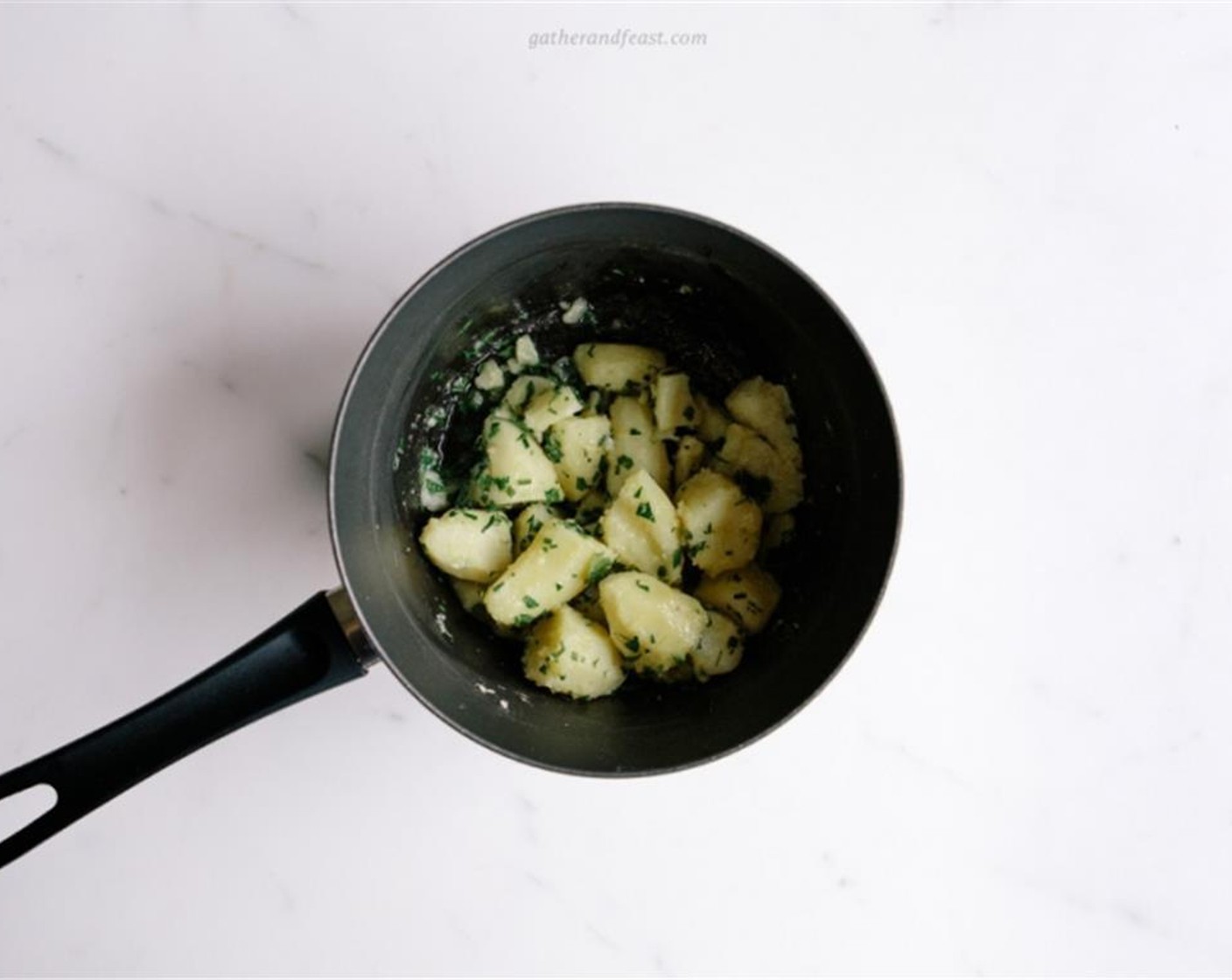 step 2 Add to the cooked potatoes some Sea Salt (to taste), Freshly Ground Black Pepper (to taste), the Fresh Chives (1 bunch) and fresh Fresh Parsley (1 bunch) finely chopped, and toss to combine.