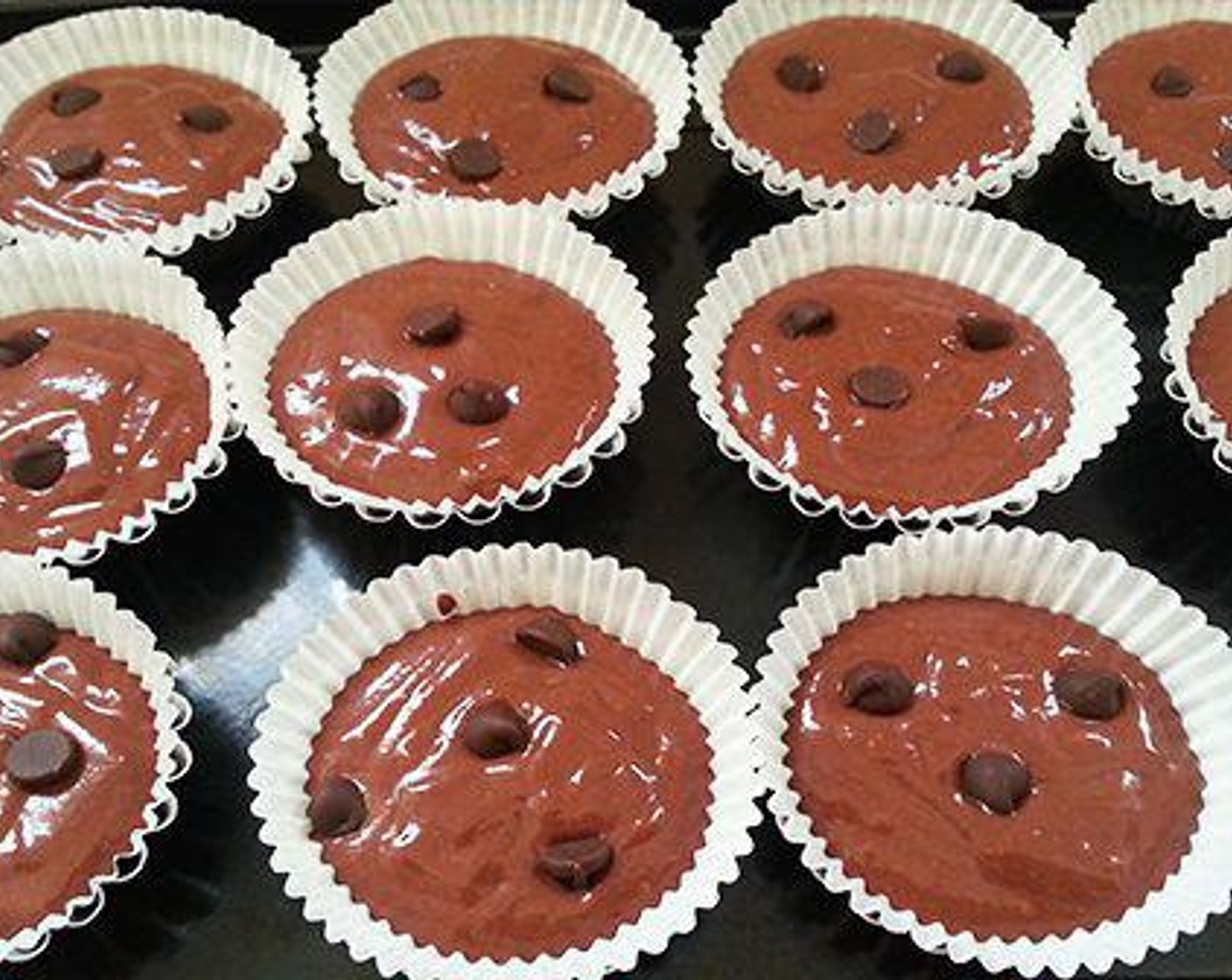 step 4 Add Chocolate Chips (1/2 cup). Fold in the chocolate chips into the batter. Grease the muffin tray or line it with paper liner. I have used individual muffin cups. Fill the cups three fourths with the batter and sprinkle few chocolate chips on top.