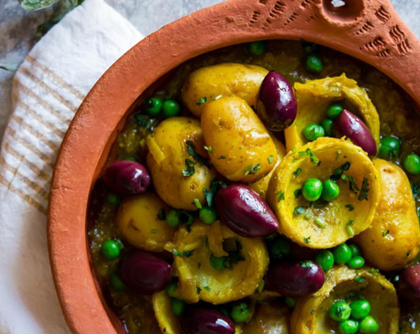 step 11 Serve warm with a side of couscous or crusty bread. Top with Kalamata Olives (3/4 cup) and Fresh Cilantro (to taste).