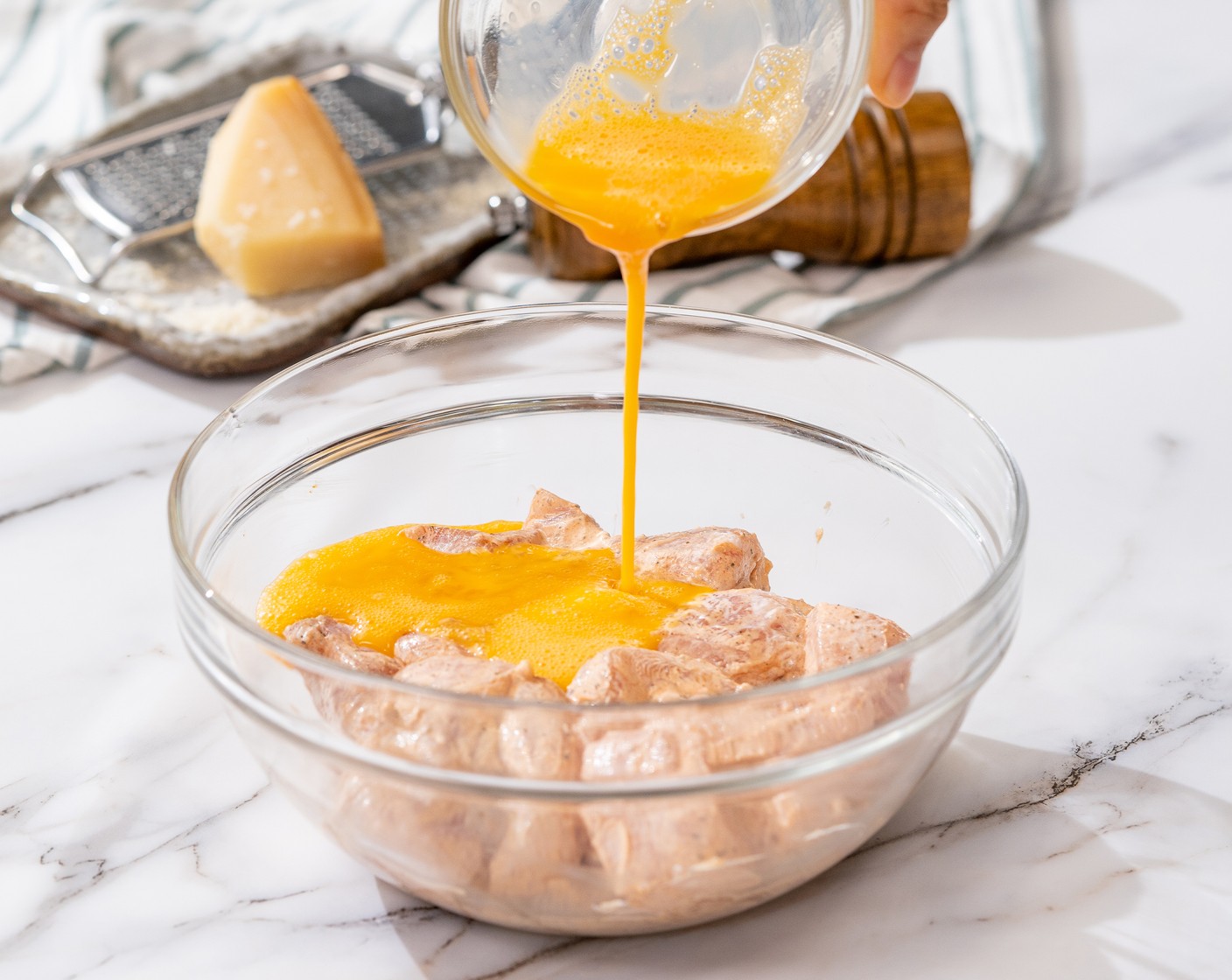 step 5 In the bowl with chicken cubes, mix in the Egg (1). Toss until well coated.