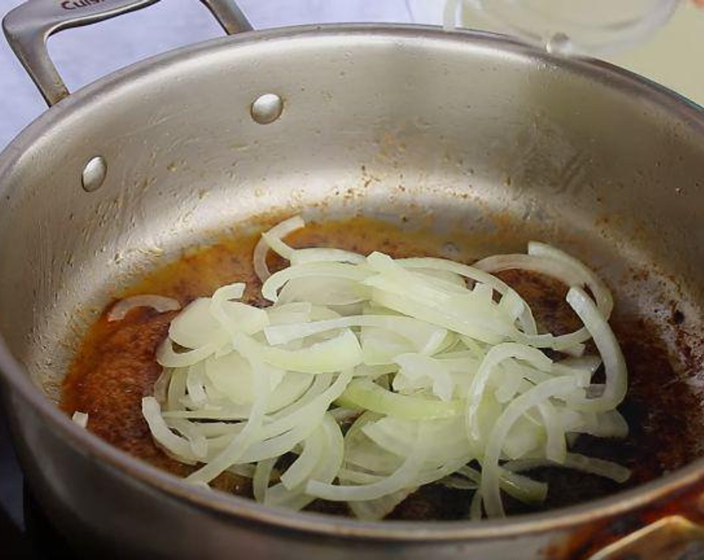 step 2 Remove the meat and add more Butter (2 Tbsp) to the pan. Next add the Onion (1) and cook for 3 minutes or until translucent.