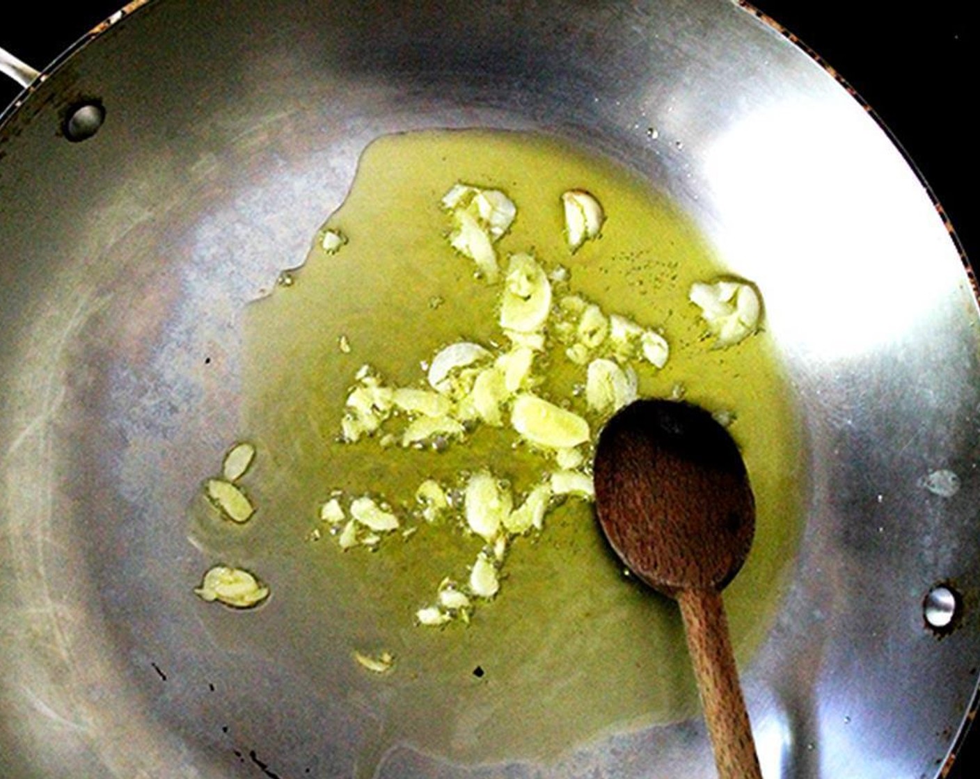 step 5 Place Extra-Virgin Olive Oil (3 Tbsp), Garlic (1 clove) in a large sauté pan over medium heat. When the garlic starts sizzling in the oil, add 4 cups of the cooked chickpeas and season with Salt (to taste) and Ground Black Pepper (to taste).