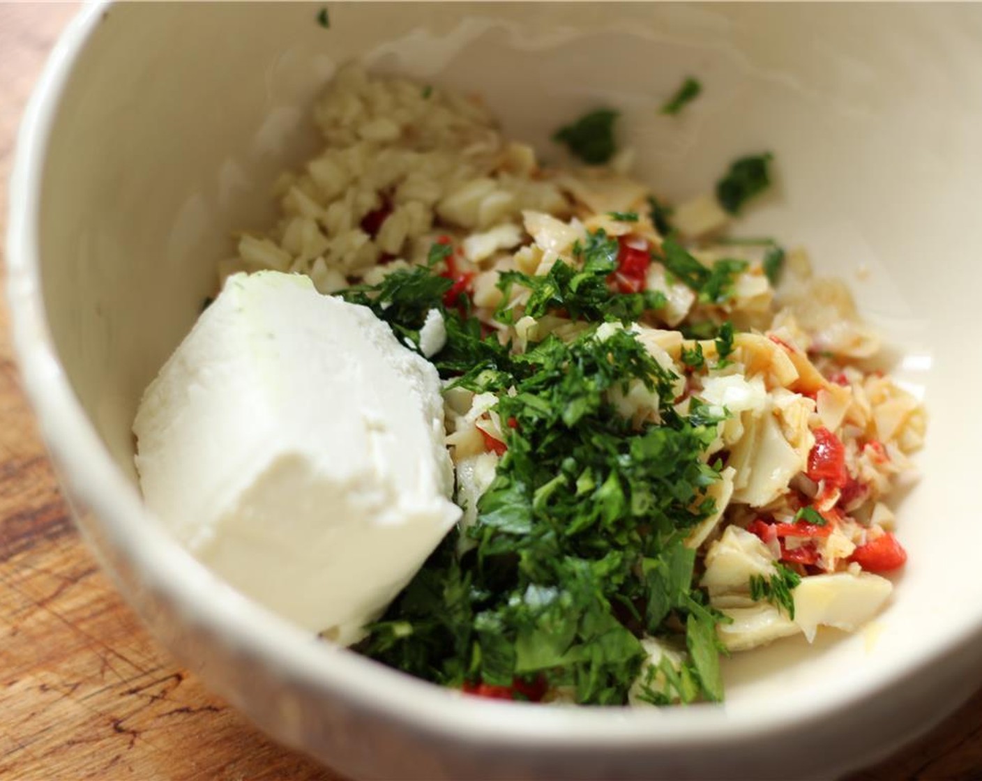 step 3 In a small bowl, mash the Goat Cheese (1/2 cup) with the parsley, artichoke hearts, and garlic.