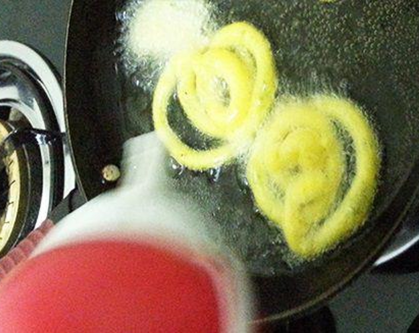 step 4 Pour Ghee (to taste) to a pan over medium-high heat. Once the oil is hot, reduce the flame to medium. Now make jilebi by piping the batter to the ghee in round spiral shape.