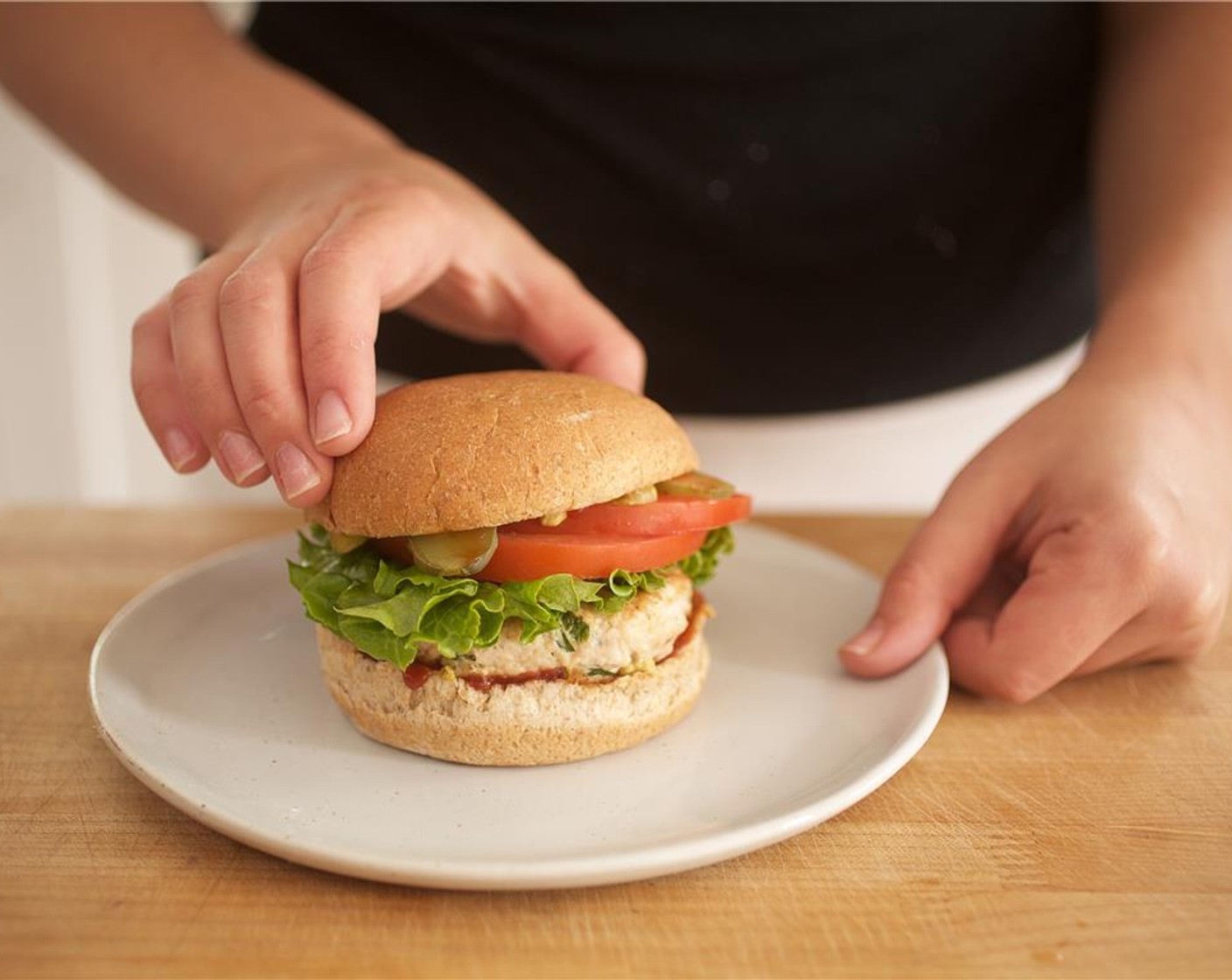 step 12 Place turkey burgers on two separate plates. Divide the fries evenly and serve with ketchup on the side.