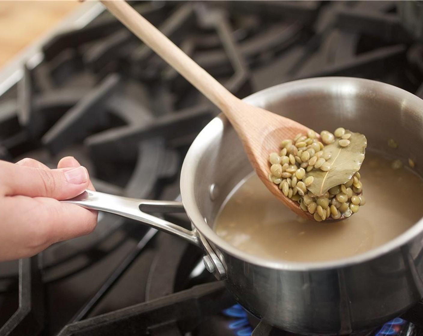step 4 In a medium saucepan over medium high heat, add Green Lentils (2/3 cup), Bay Leaf (1), and two cups of cold water. Bring to a boil. Cover and lower heat to a simmer, cook for 14 minutes or until lentils are tender but not overcooked. Remove the bay leaf and discard.