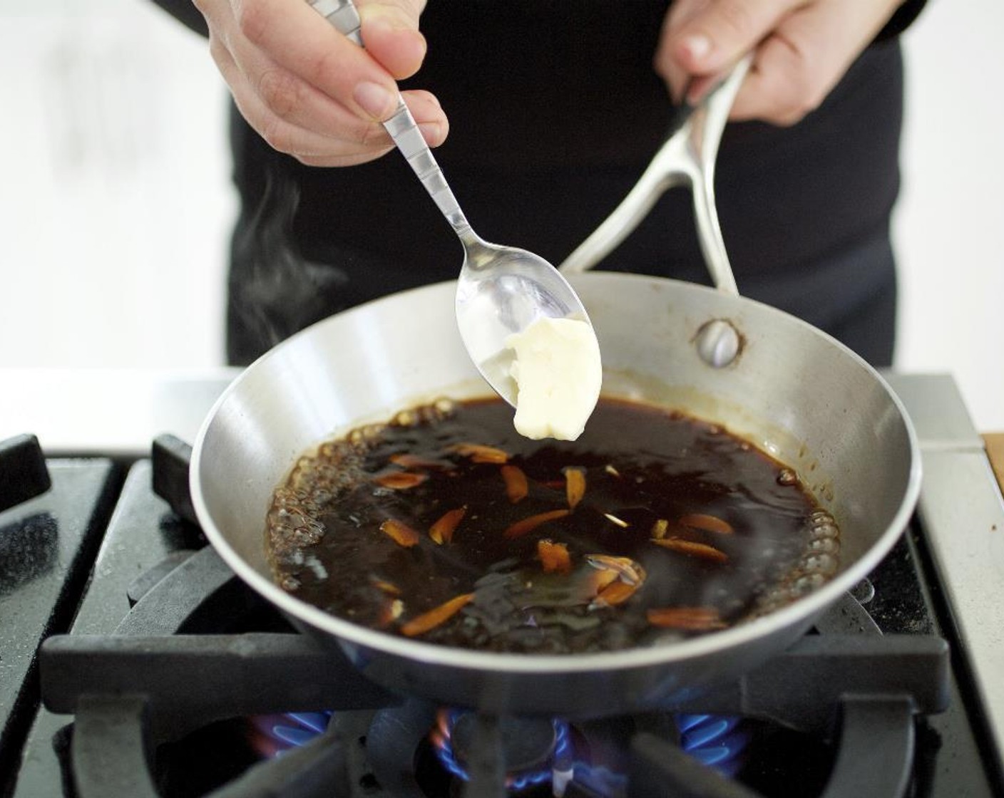 step 5 In a small saucepan over medium heat add the Tamari Soy Sauce (2 Tbsp), Worcestershire Sauce (4 Tbsp), half of the sliced garlic, and only 2 teaspoons of the Butter (3 Tbsp) and cook for 3 to 4 minutes, stirring occasionally until the sauce thickens.