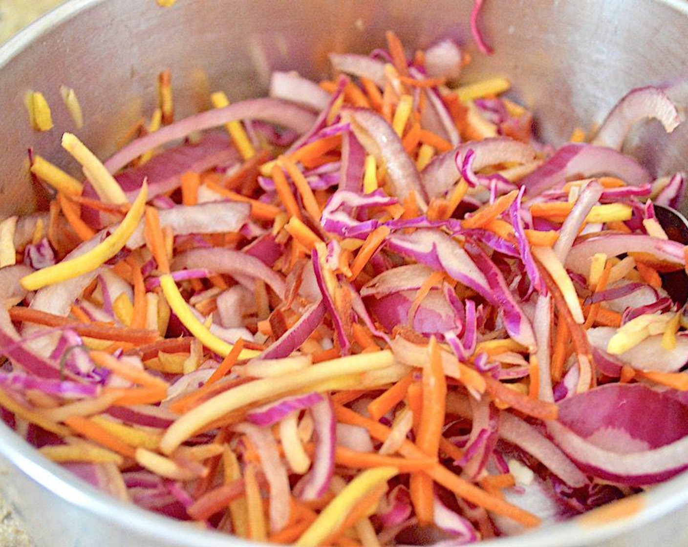 step 1 Make the slaw. Stir Red Cabbage (2 cups), Rainbow Carrots (2 cups), Red Onion (1/2), Lime (1), Soy Sauce (1 Tbsp), and Rice Vinegar (1 Tbsp) together thoroughly in a bowl. Set it aside to let the flavors marry and the liquids wilt the veggies a little while you make everything else