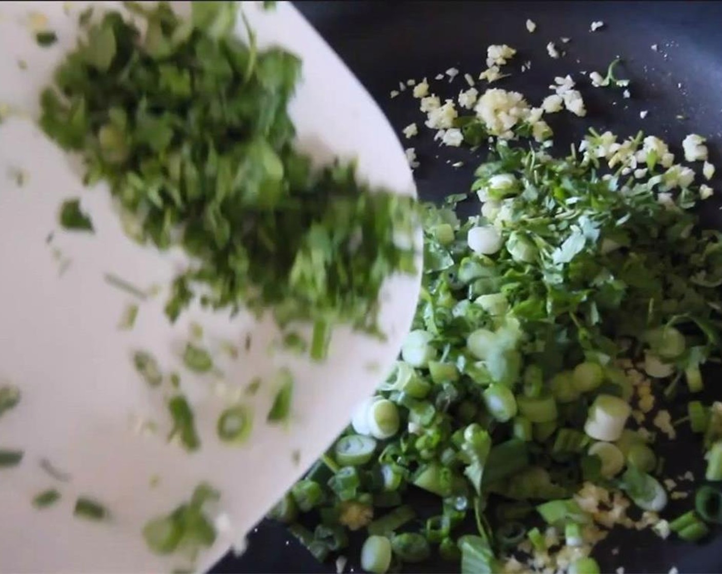 step 9 Then add cilantro and scallion, and cook for 30 seconds.
