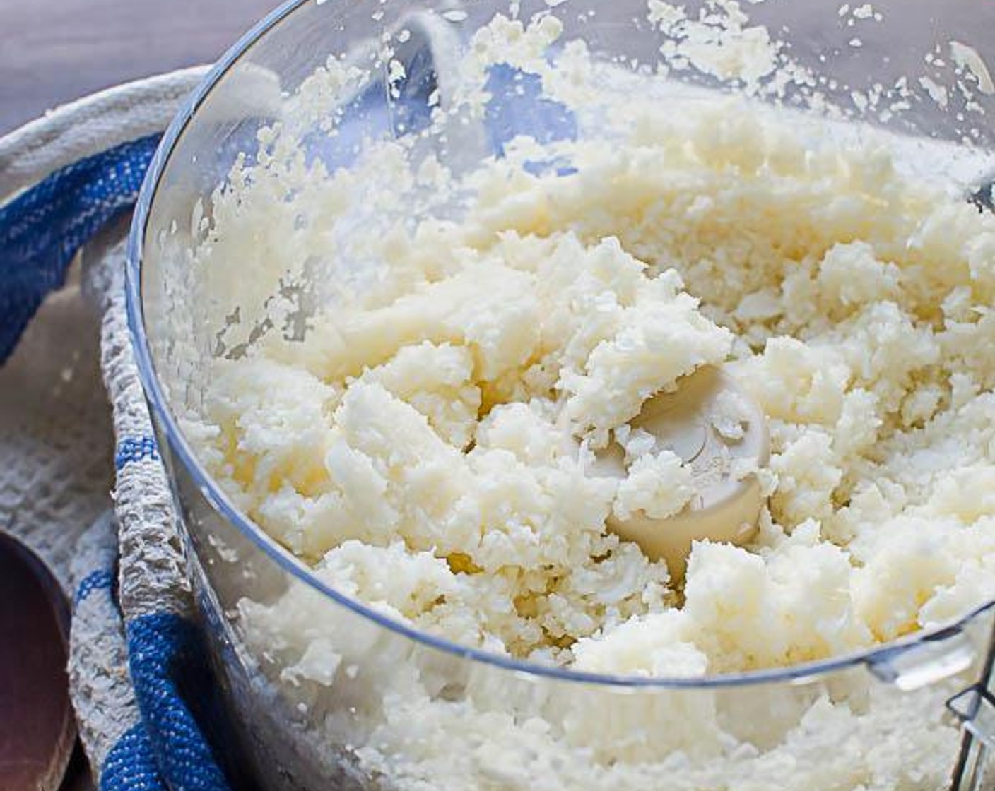 step 1 Cut the Cauliflower (1/2 head) into small florets and add them to the work bowl of a food processor. Pulse until the cauliflower is chopped into fine granules resembling couscous.