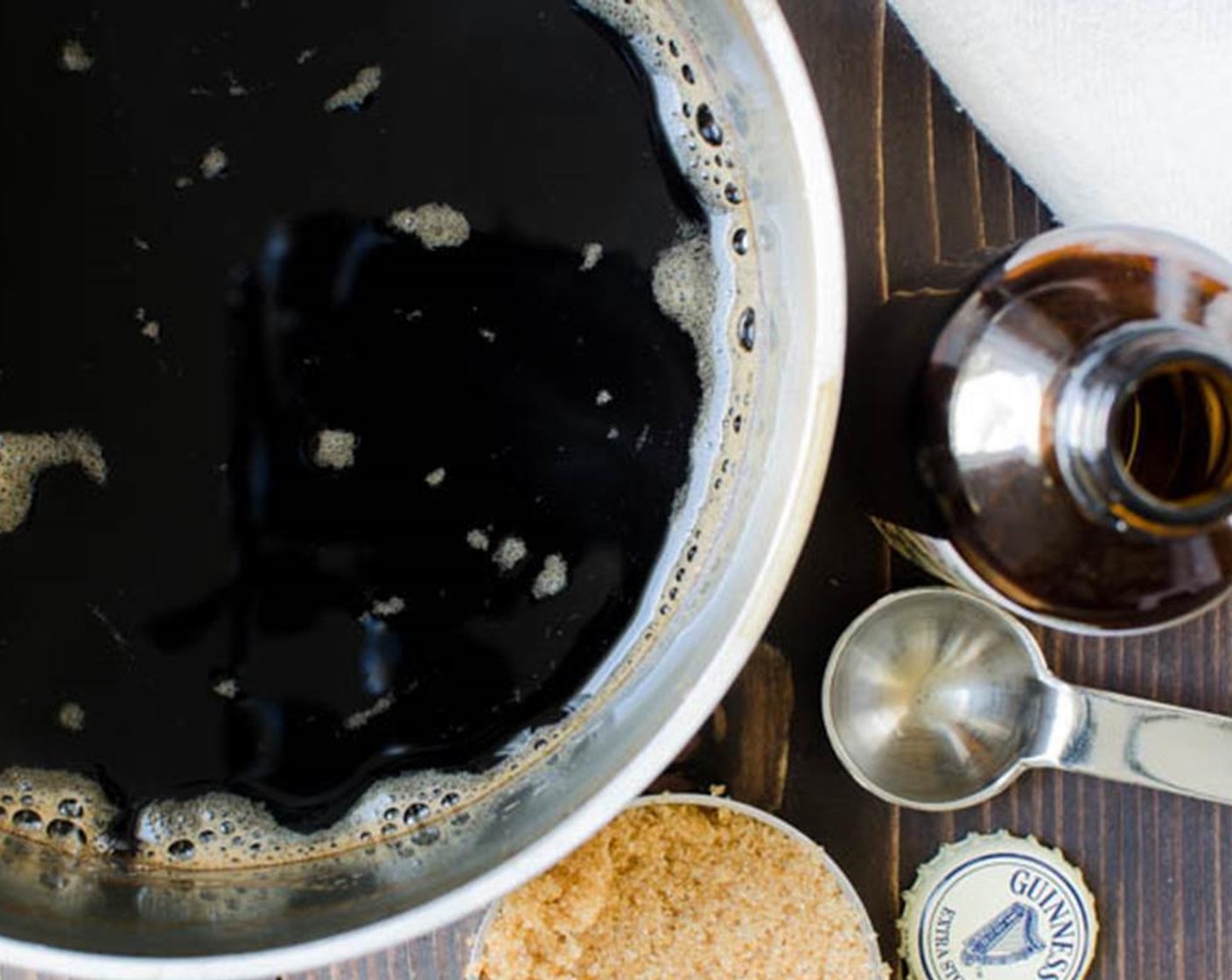 step 1 Pour Guinness® Stout Beer (12 fl oz) into a medium saucepan and heat to boiling. Reduce heat to a rapid simmer and cook until the stout is reduced by half.