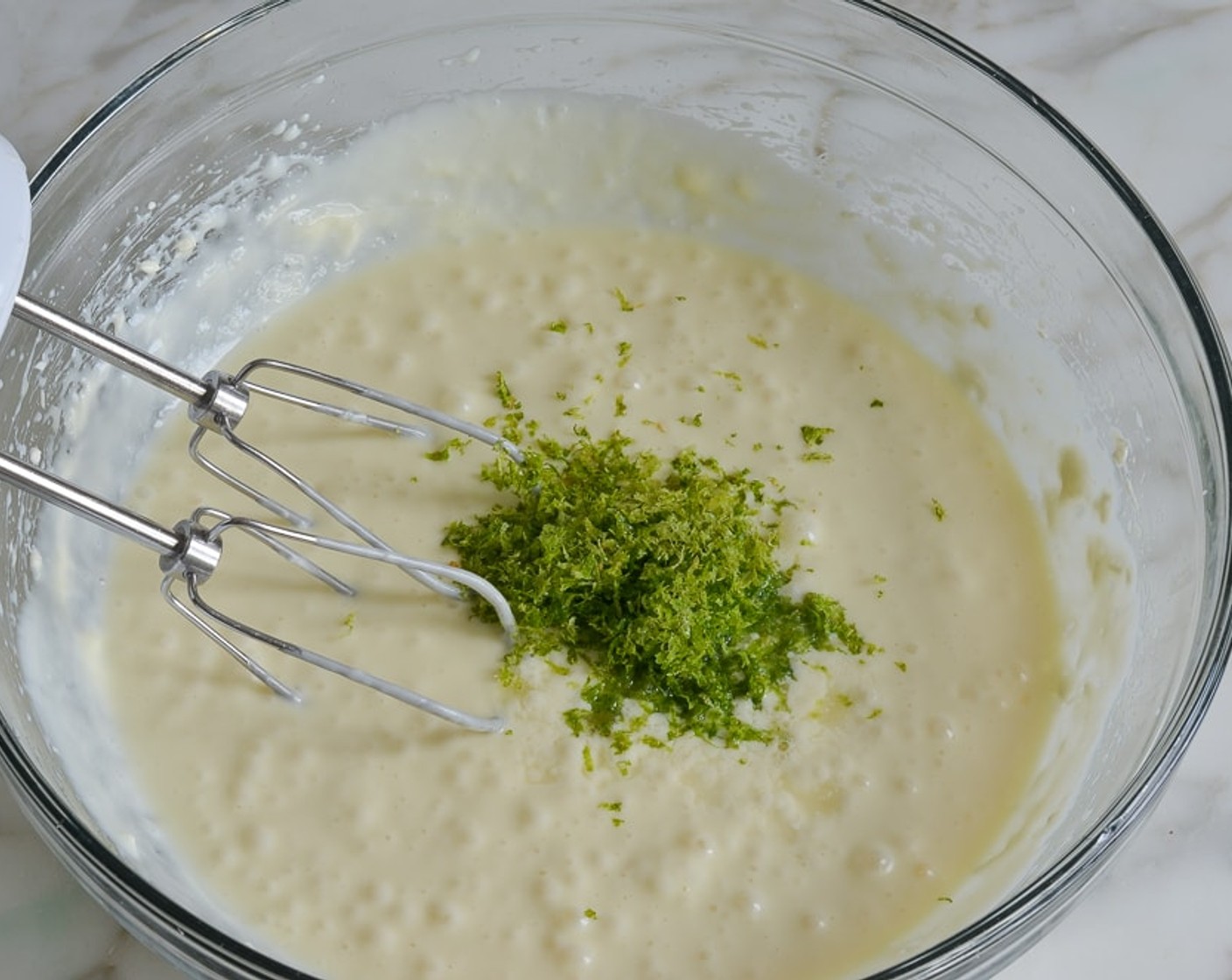 step 8 Add the Heavy Cream (1/4 cup), lime zest, lime juice and Salt (1 pinch). Beat until evenly combined, about 30 seconds.