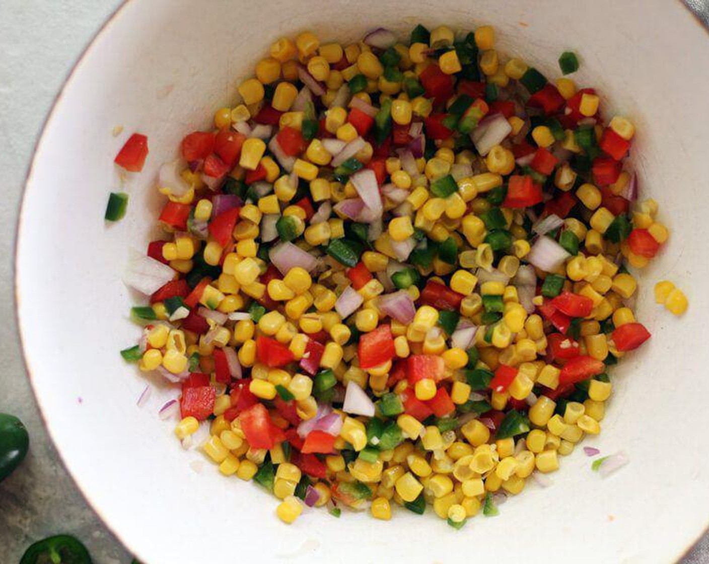 step 1 In a large bowl, combine the Whole Kernel Corn (2 3/4 cups), Jalapeño Peppers (2), Red Onion (1/2 cup), Red Bell Pepper (1/2) and Garlic (2 cloves). Set aside.