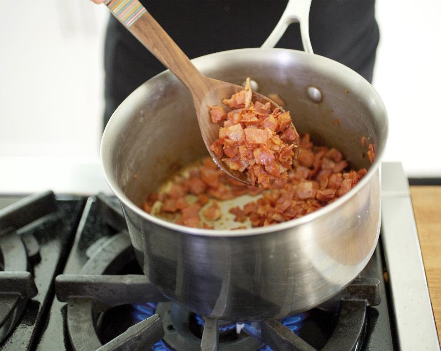 step 7 Heat a medium saucepot over medium-high. When hot, add the chorizo and ham and cook for 3 minutes; hold for next step.