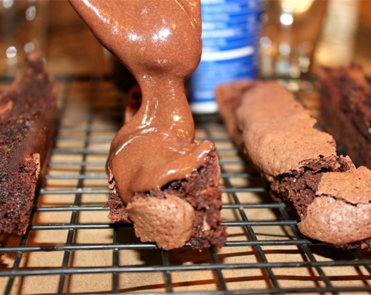 step 4 Slightly melt the Chocolate Frosting (1 cup) to loosen it and frost the brownie fries on one or both sides.