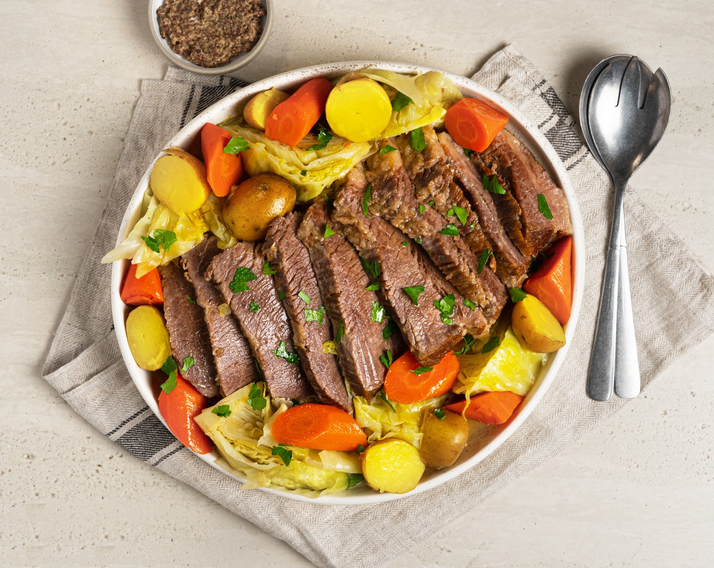 step 5 Transfer sliced beef with carrots, potatoes, and cabbage with broth to the serving plate. Garnish with Fresh Parsley (2 Tbsp) and serve with Whole Grain Mustard (2 Tbsp) on the side.