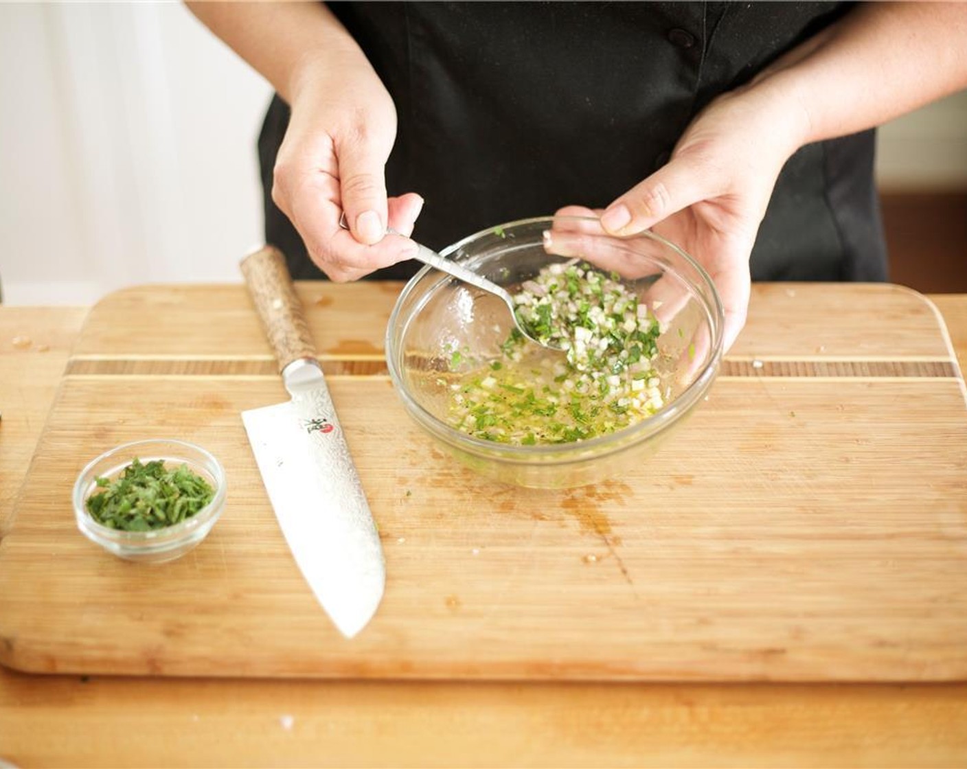 step 10 Meanwhile, finely chop the Shallot (1) and just the Fresh Cilantro (1 cup) leaves. Place into a small bowl. Add the White Wine Vinegar (2 Tbsp), two tablespoons of water, Canola Oil (2 Tbsp), Salt (1/2 tsp), and Ground Black Pepper (1/4 tsp). Mix well.