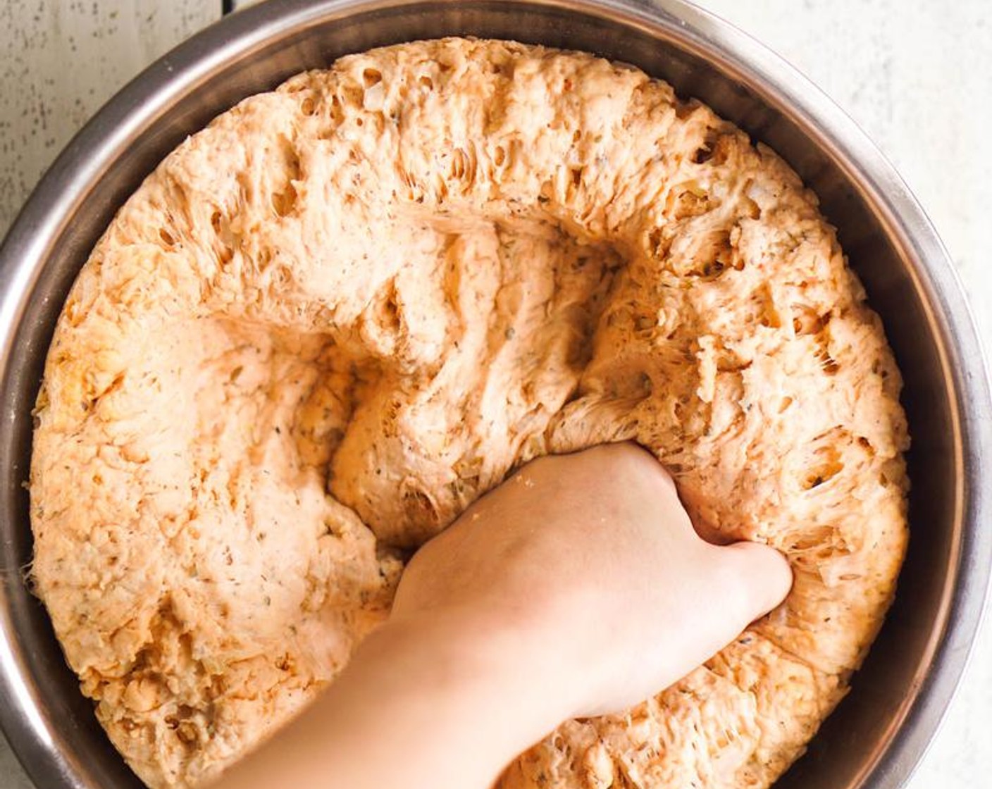 step 6 Transfer the dough to a floured surface and knead until smooth and elastic.