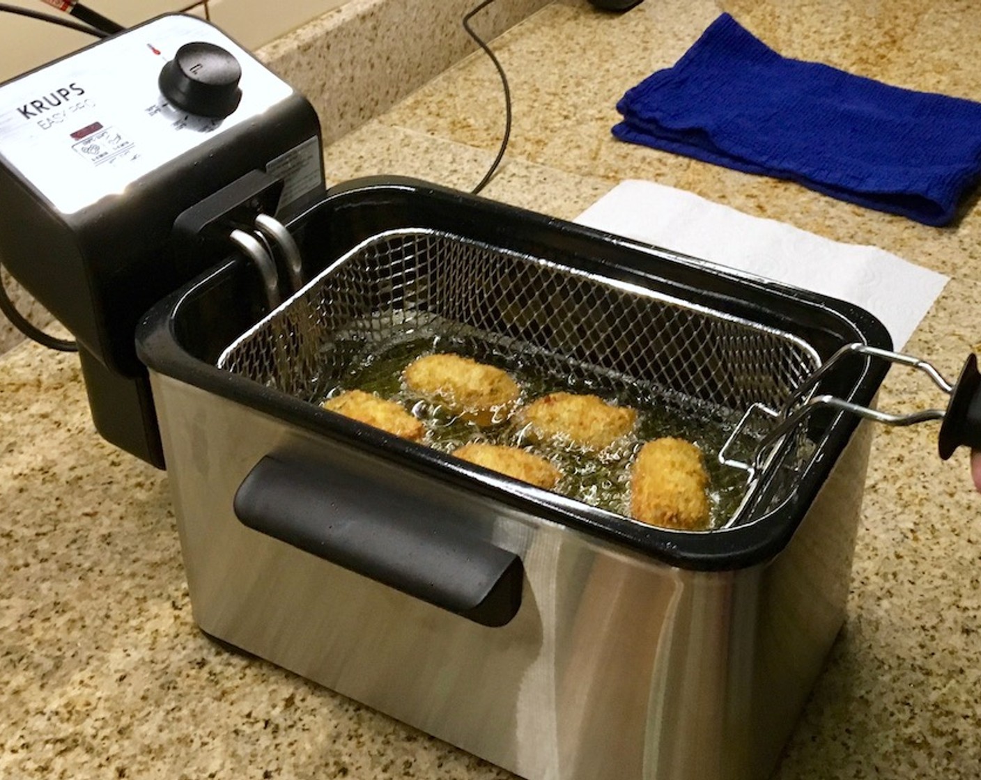 step 19 Using the instructions for your deep fryer, heat Vegetable Oil (as needed) to 340–360 degrees F (170–180 degrees C). Cook in small batches, carefully slide croquetas into the oil. Fry for 2–3 minutes, until golden brown.