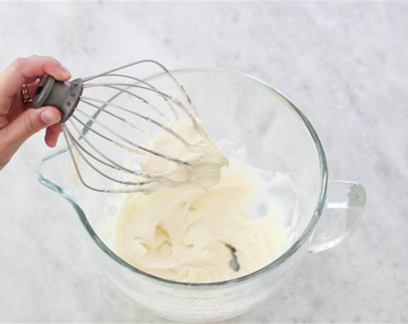 step 8 Then add the Powdered Confectioners Sugar (1 cup) and Vanilla Extract (1 tsp). Start with a slow speed then increase speed until the frosting is smooth and fluffy.