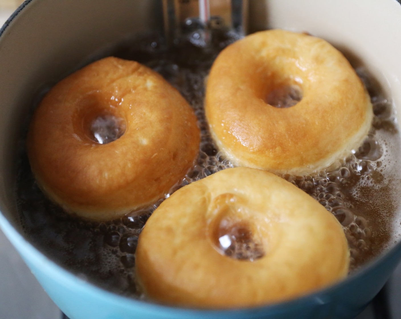 step 15 Begin frying your doughnuts in batches, for around 2-3 minutes on each side, or until nicely puffed and golden.
