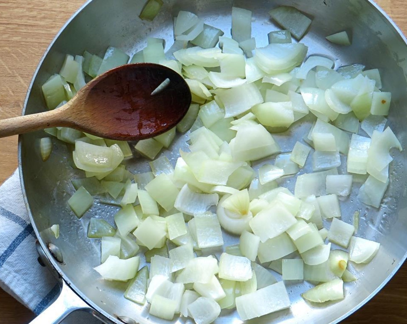 step 3 In a large skillet, heat the Olive Oil (1 Tbsp) over medium heat. Add onions and sauté 2 to 3 minutes until softened and slightly translucent.