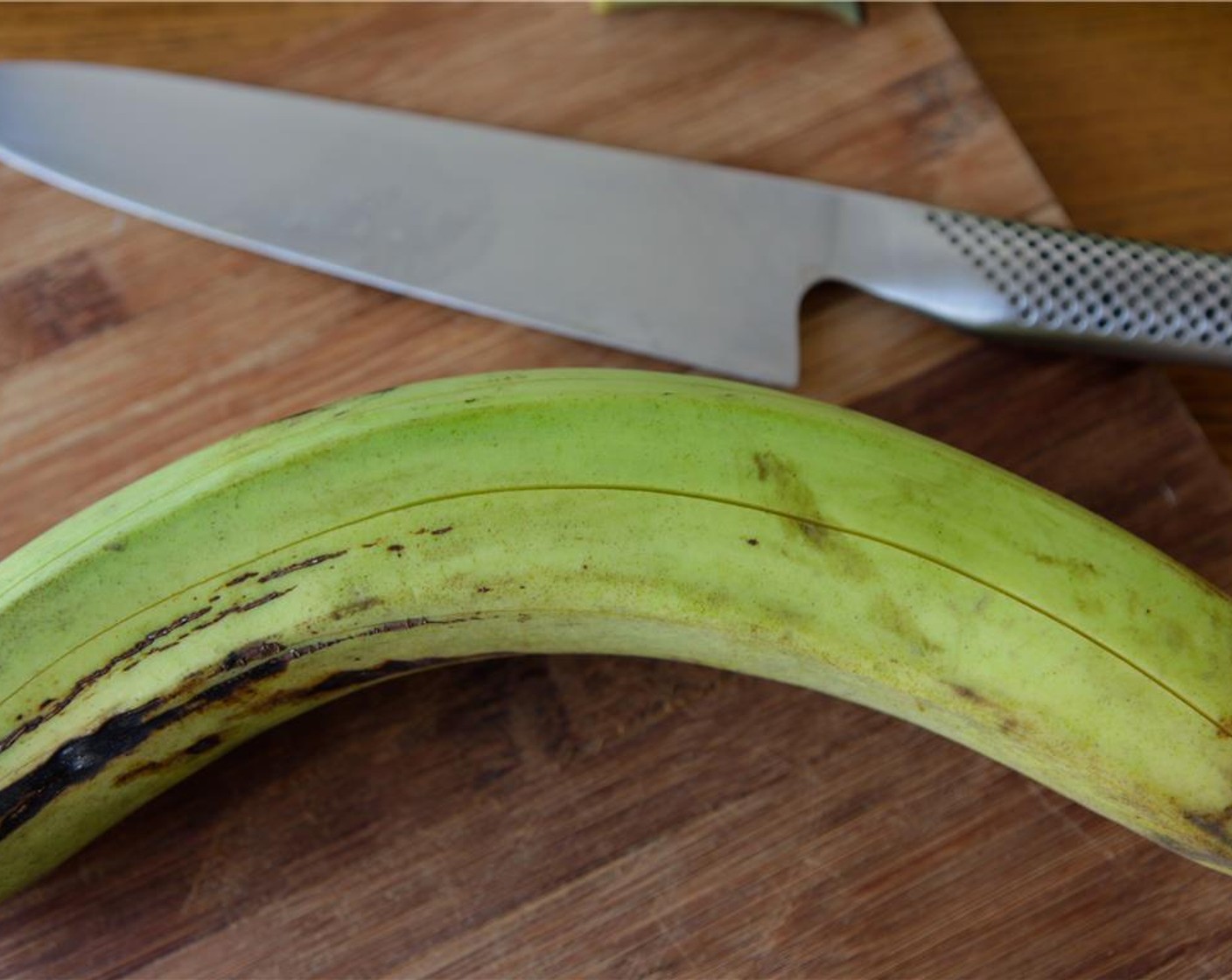 step 3 Using a knife, score the skin lengthways a few times to make it easier to peel.