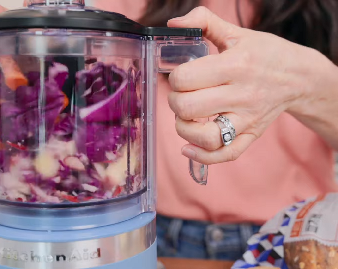 step 1 Prepare slaw. Using a box grater shred the Apple (1/2), Carrot (1), and Red Cabbage (1/4) or place all ingredients into a small food processor to shred.