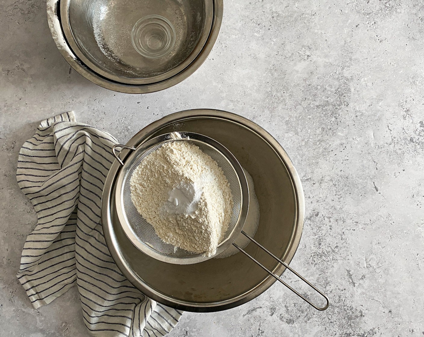 step 2 Place Granulated Sugar (3 cups) into a large bowl, then sift All-Purpose Flour (3 cups), Baking Soda (1/2 Tbsp), and Salt (1 pinch) into the bowl. Mix the sugar with the sifted ingredients.