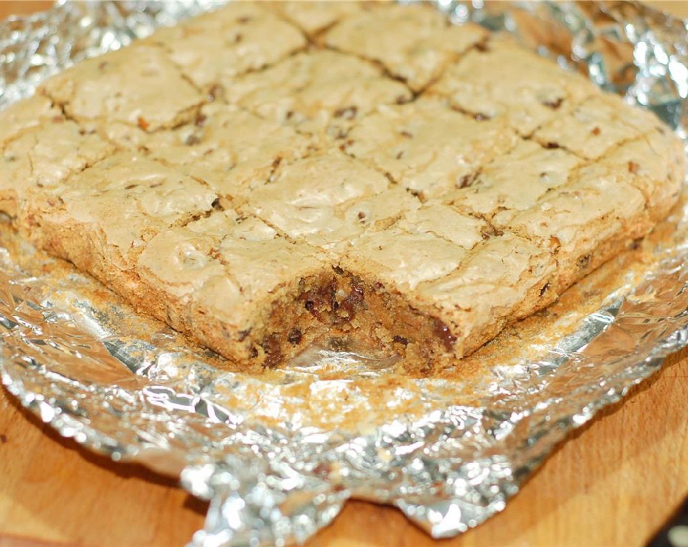 step 10 Once cooled, gently lift the foil out of the pan, place the blondies on a cutting board and cut into squares.