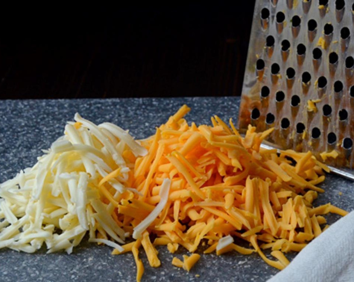 step 7 Combine the Monterey Jack Cheese (1/2 cup) and Shredded Mild Cheddar Cheese (3/4 cup) and transfer to a small bowl.