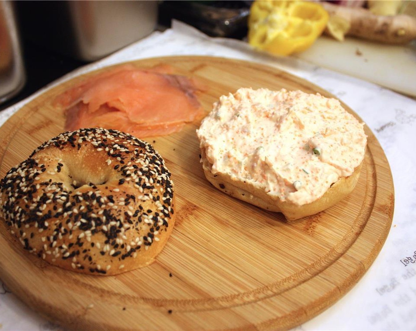 step 3 Slice open the Bagel (1) and toast to a nice crunchy texture. Spread the tobiko cream cheese on both faces of the bagel.