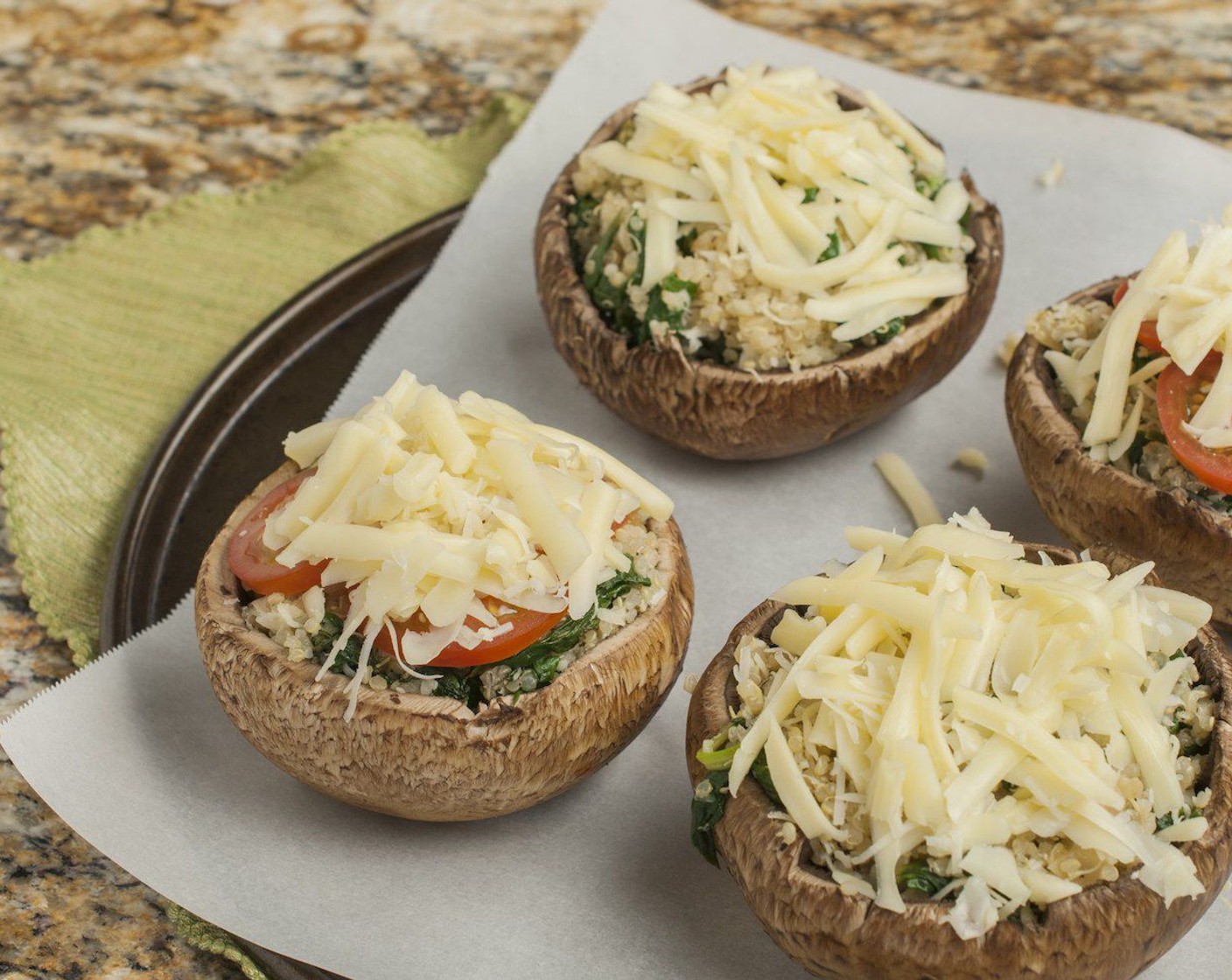 step 5 Fill mushrooms with an approximate heaping 1/3 cup of mixture, pressing just slightly to fill in the mushroom cavity. Top with Tomatoes (to taste) if desired and then sprinkle each with Shredded Mozzarella Cheese (1/2 cup).