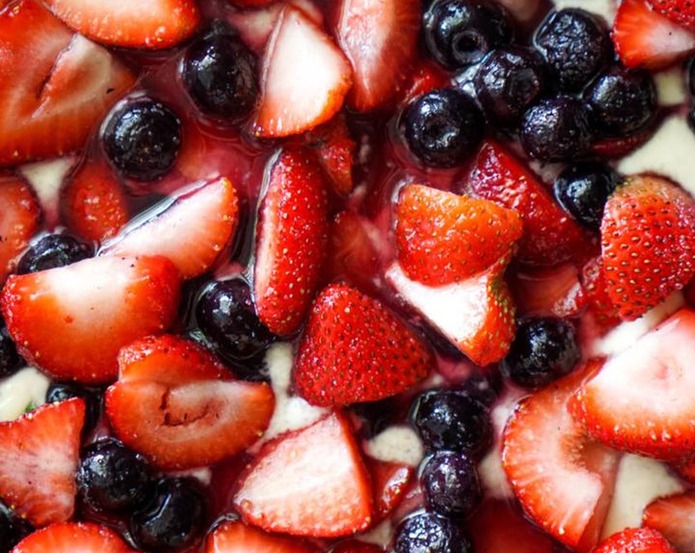 step 5 Spoon the batter into the pan and spread evenly. Pour the fruit evenly over the batter along with any juices from the berries. DO NOT MIX!