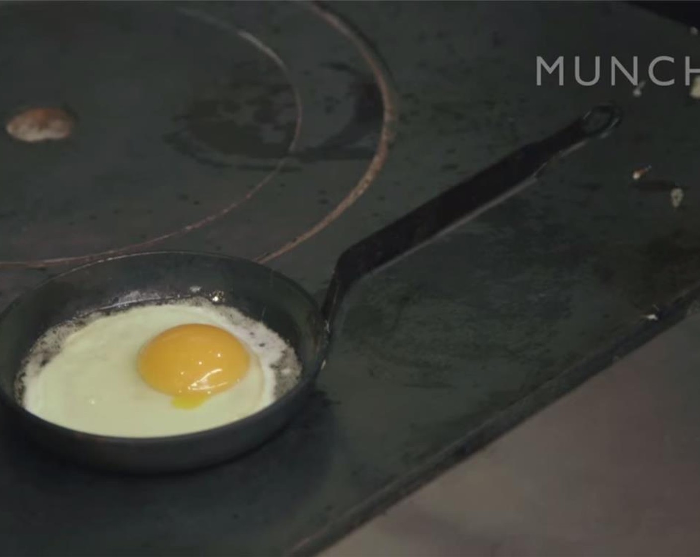 step 9 Meanwhile, heat ½ tablespoon butter in a small skillet or egg pan over medium heat. Gently crack Egg (1) into the pan, being careful not to break the yolk. Cook until white is just done and not snotty. Sprinkle with salt and place on top of the sandwich.