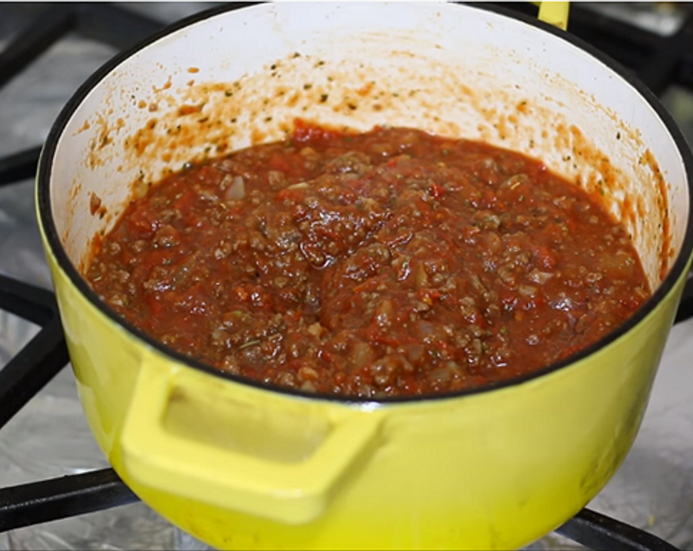 step 2 Stir in Canned Crushed Tomatoes (3 1/3 cups), Italian Seasoning (1 Tbsp), and season with Salt (to taste) and Ground Black Pepper (to taste). Mix until well combined, cover and simmer on low heat while you prepare the cheese mixture.