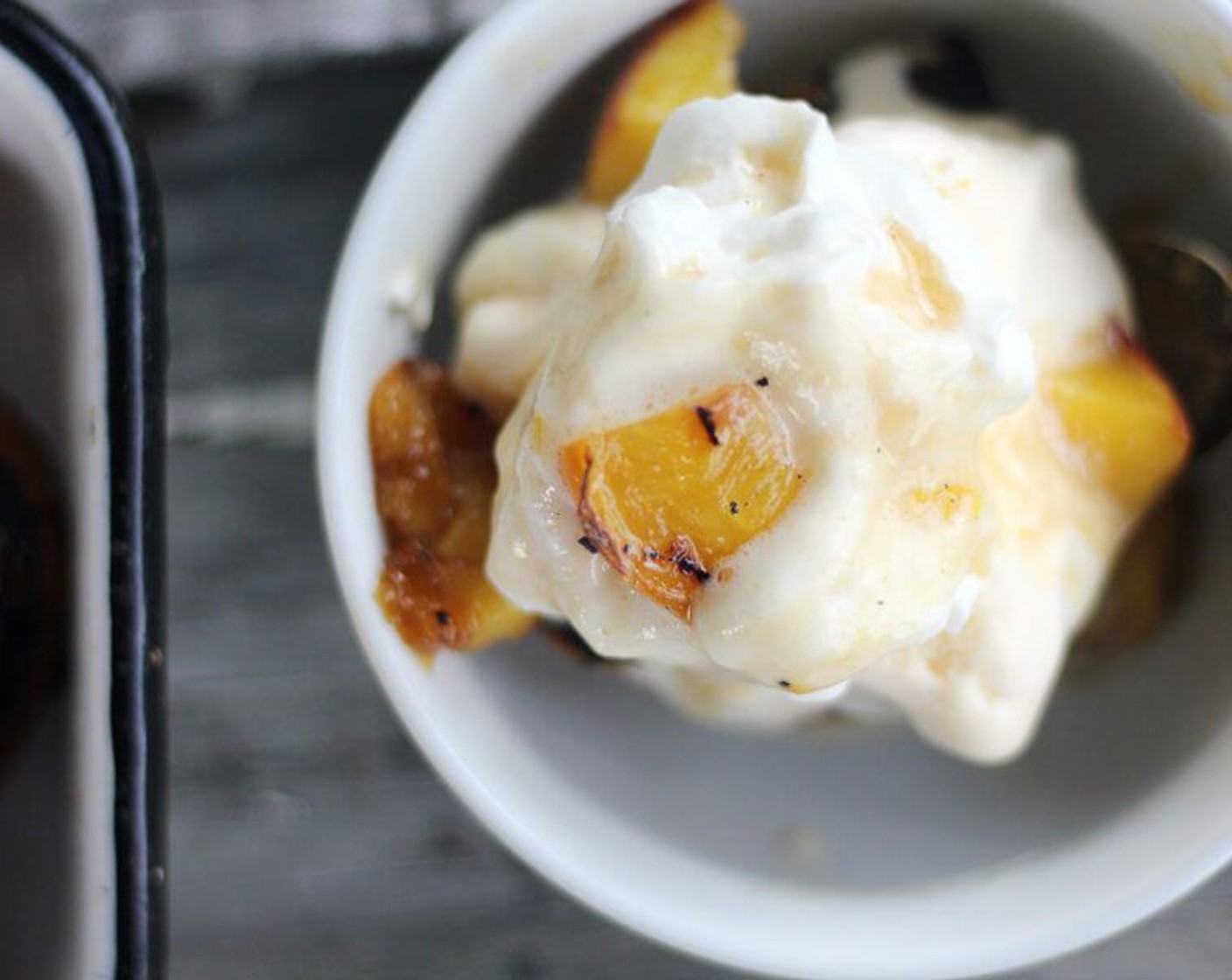 step 9 Drizzle the grilled peach topping over the top and serve immediately.