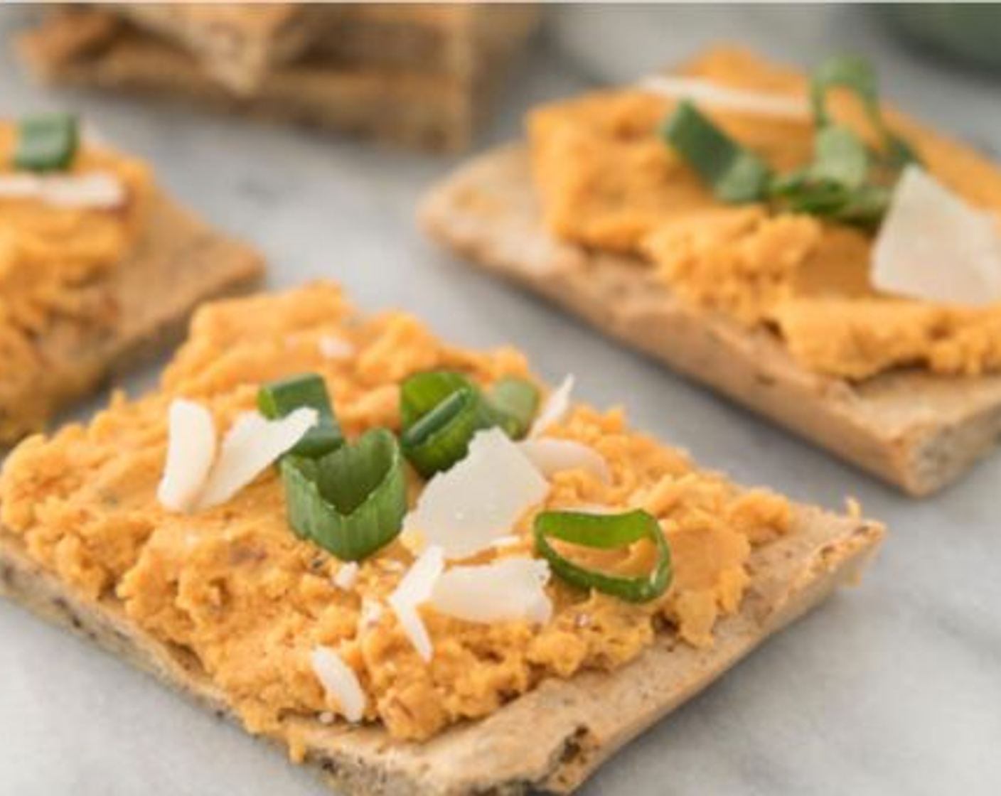 step 9 Spread sweet potato hummus on each flatbread square.