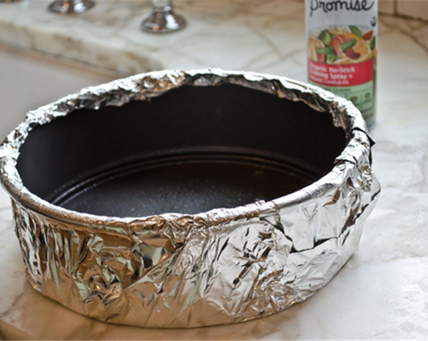 step 1 For the crust: preheat the oven to 325 degrees F (160 degrees C). Wrap a 9-inch springform pan with aluminum foil. Spray the bottom and sides of the pan with Nonstick Cooking Spray (as needed).