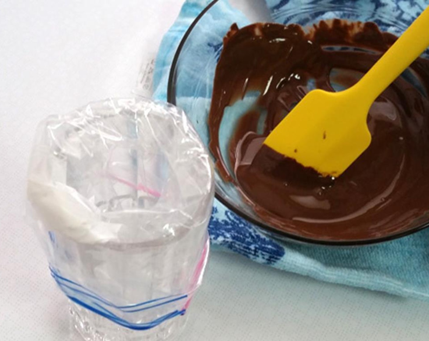 step 19 To make the writing chocolate, heat Bittersweet Chocolate (4 Tbsp) until just melted and stir in Vegetable Oil (1/2 tsp) to get a pipeable consistency. Let the mixture cool down a little if it's too runny. Place the mixture into a disposable piping bag.